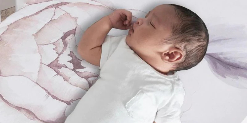 Baby sleeping on crib mattress