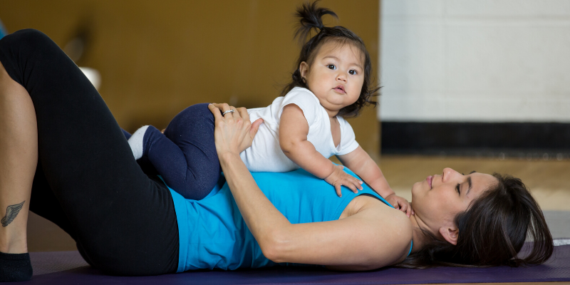 Mother stretching with daughter
