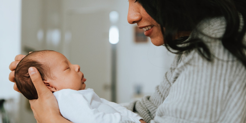 Woman Holding Newborn Baby