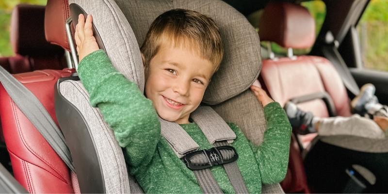 Little Boy Sitting in Foonf Convertible Car Seat 