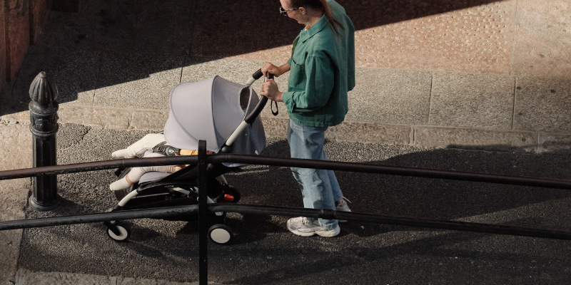 Dad pushing Stokke Yoyo3 Stroller