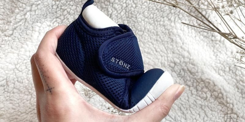 Stonz Cruiser shoe being squeezed in parent's hand