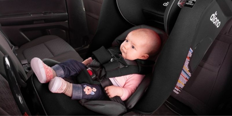 Baby Sitting in Diono Radian 3 RXT Safety + Convertible Car Seat in Black