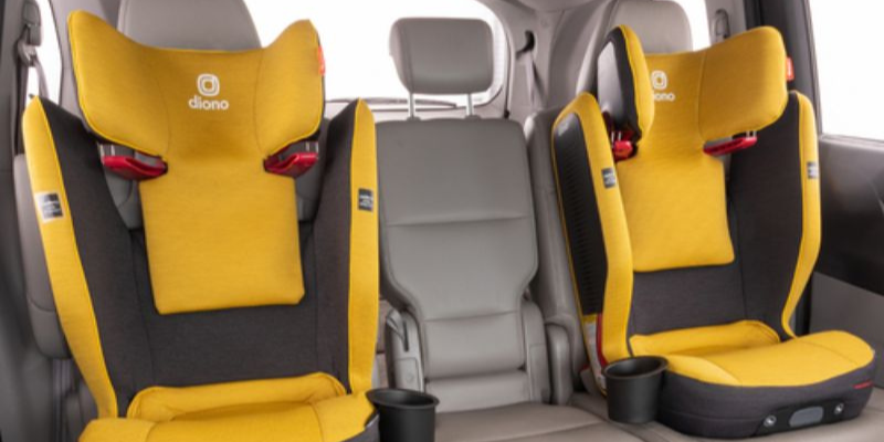 Two Yellow Diono Monterey 5iST FixSafe Booster Car Seat in Back Seat of Car