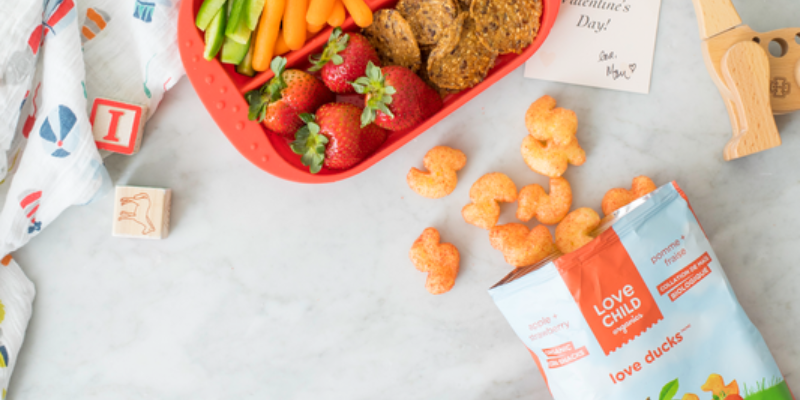 Love Child Puff Snacks on Table With Food