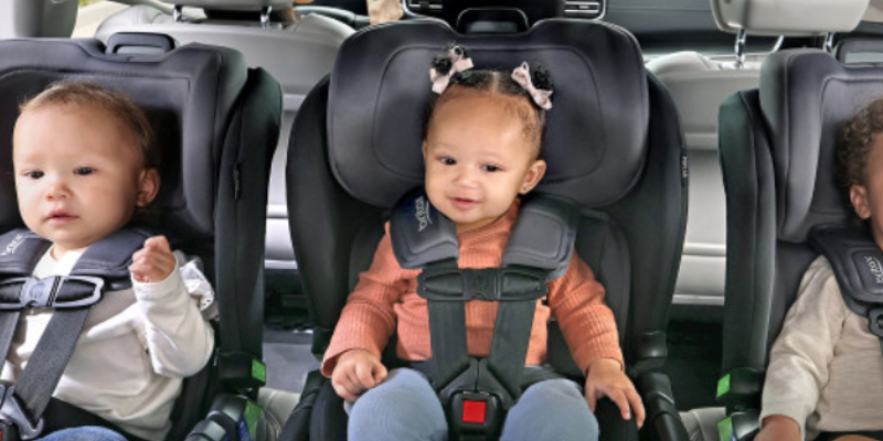 Three Children Each Sitting In Back Seat of Car in Britax Poplar Convertible Car Seat 