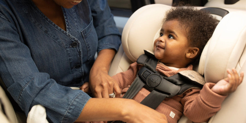 Baby Smiling While Sitting In Maxi-Cosi Magellan All-in-One Car Seat