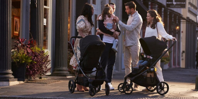 Four Adults on SideWalk With Two baby Jogger City Sights Strollers