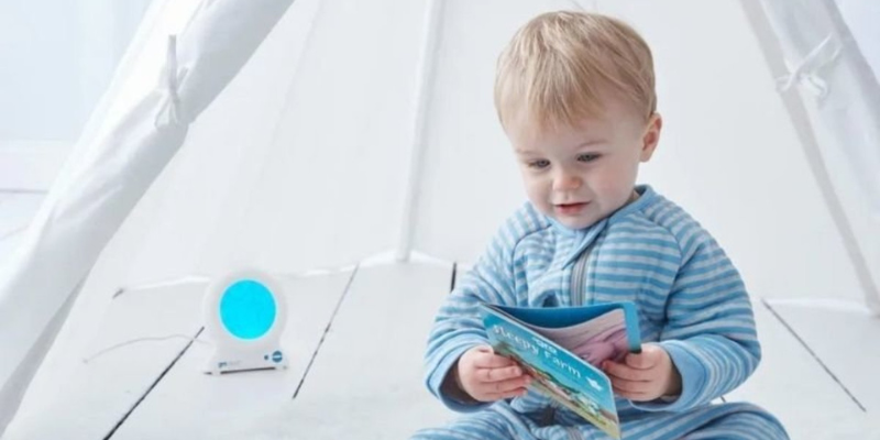 Toddler reading beside a GroClock