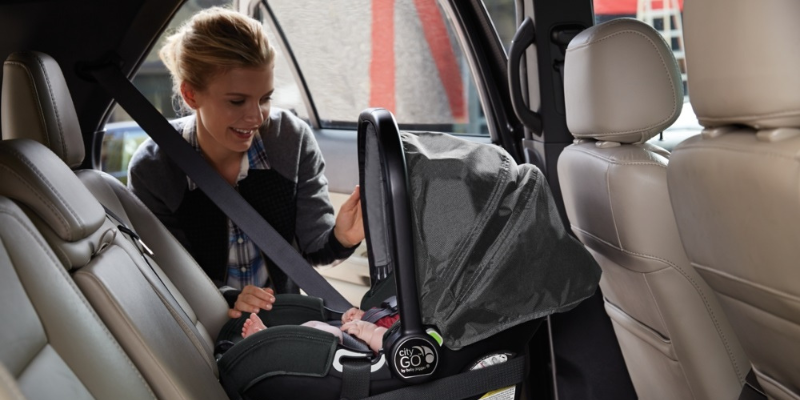 Mom buckling in baby