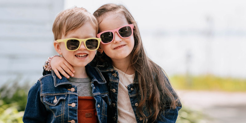 Boy and Girl With Sunglasses on Smiling 