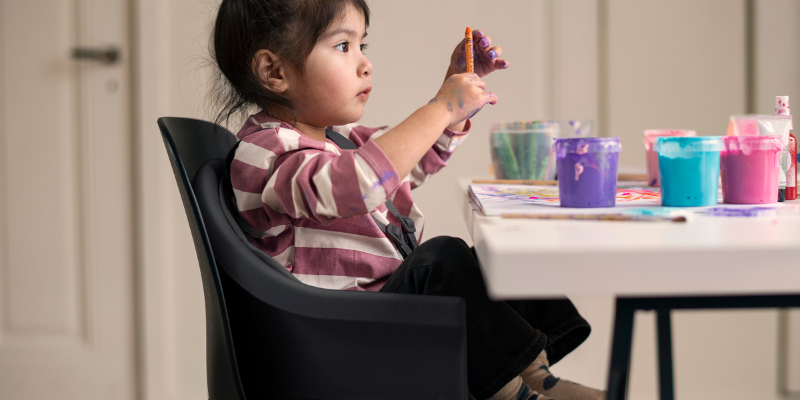 Baby playing in a Maxi Cosi Moa High Chair