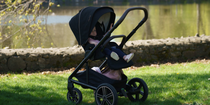 Baby sat in Nuna MIXX Next Stroller in park