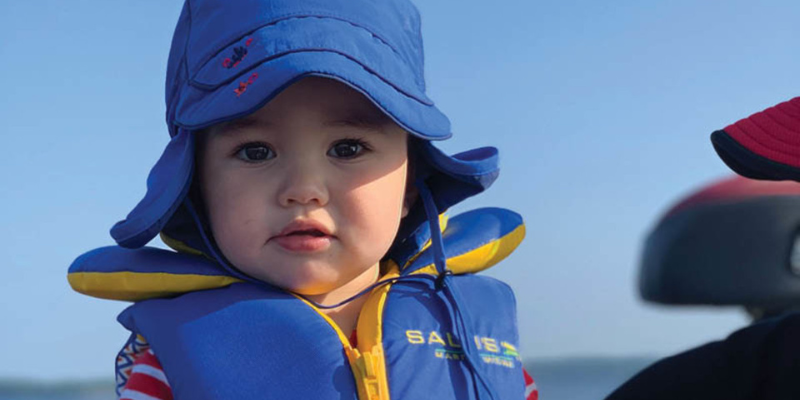 Baby At Beach Wearing Salus Life Jacket in Blue 