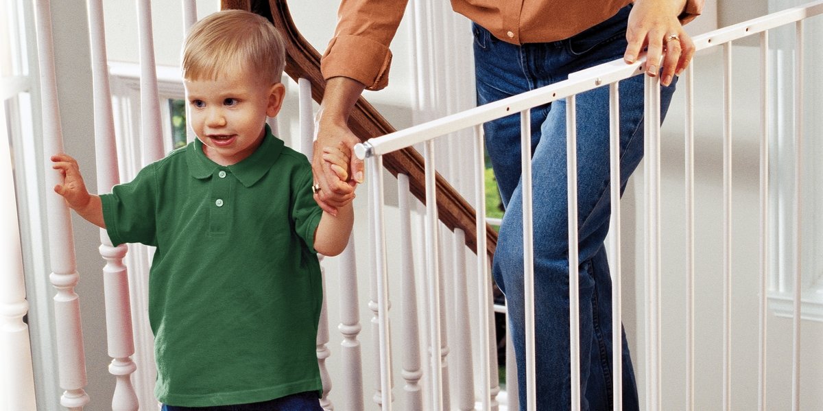 Child walking through kidco gate