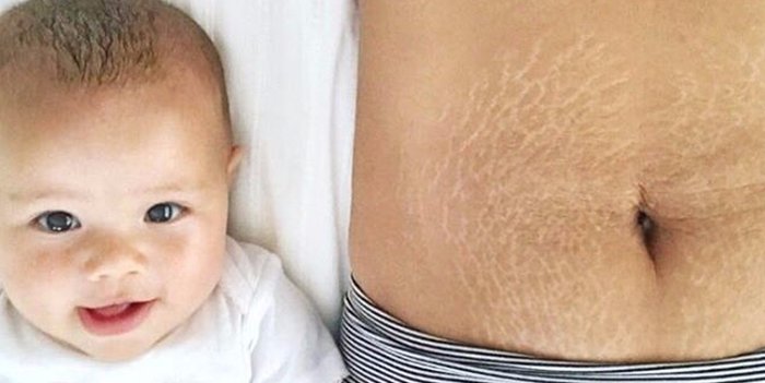 Baby Smiling and Lying Beside Mother's Tummy