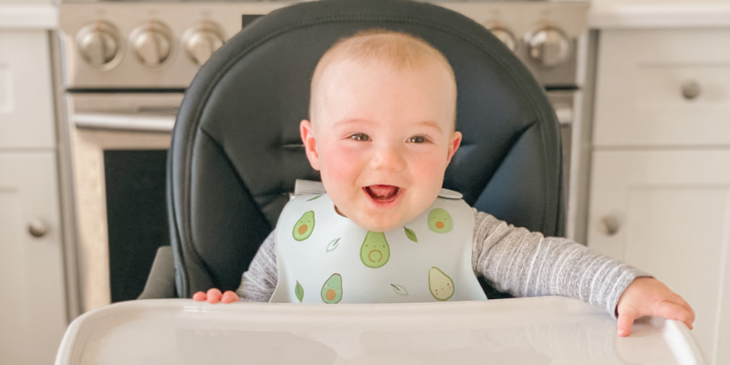 Smiling baby in Peg Perego Siesta High Chair