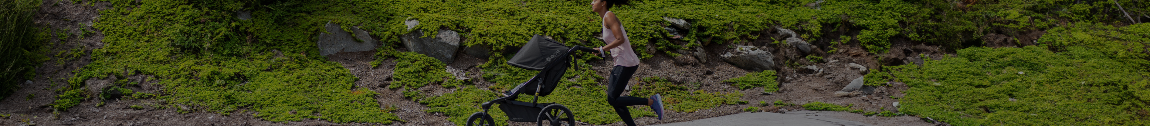 Mother running with baby in a BOB Alterrain Pro jogging stroller