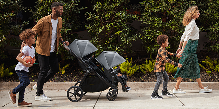 Family walking with Baby Jogger stroller
