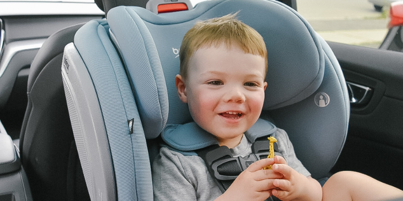 Little boy sitting & smiling in a Britax Advocate ClickTight Convertible Seat