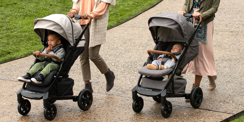 2 moms walking with Nuna Tavo Next Strollers