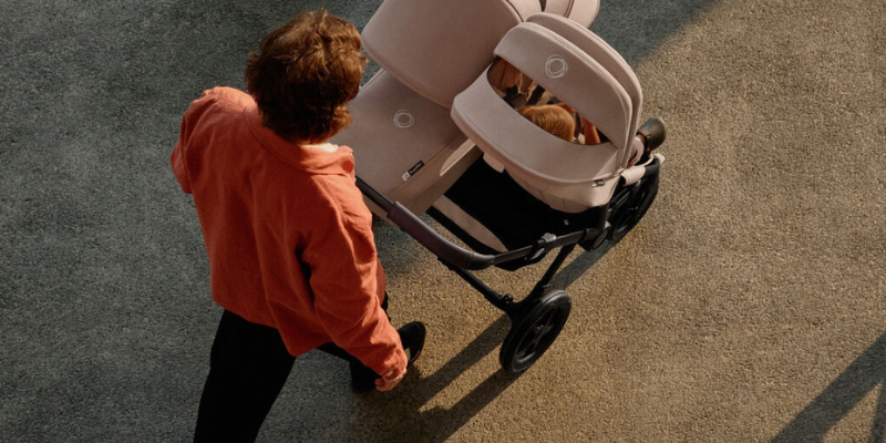 Dad pushing Bugaboo Donkey 5 Stroller in double mode