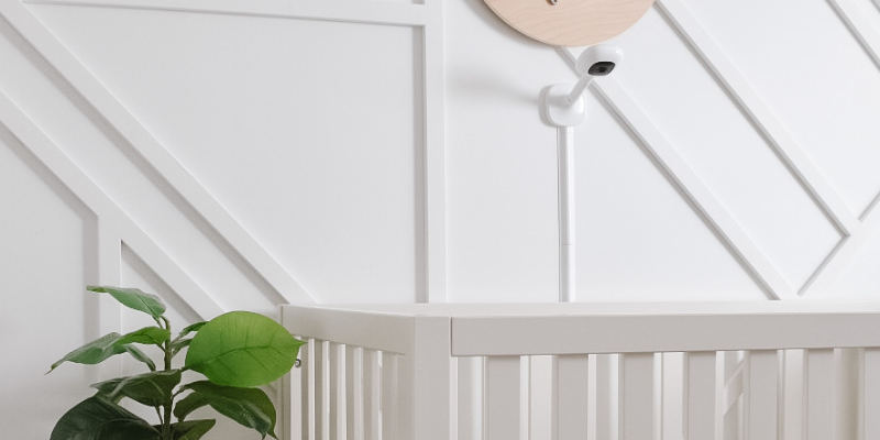 Nanit Pro Complete baby monitor mounted on wall