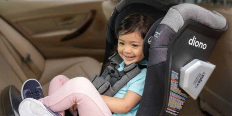Child Sitting in All-In One Car Seat in Back Seat of Car