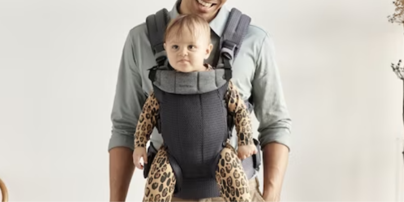Baby Sitting forward-facing in Baby Bjorn Harmony Carrier 