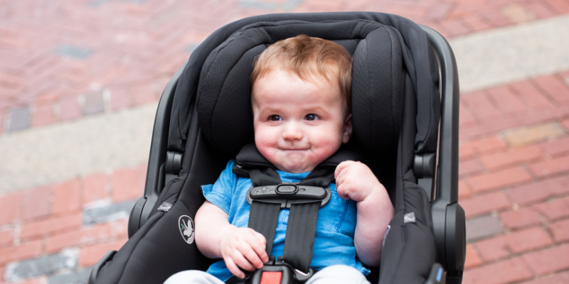 Little Boy Sitting in UPPAbaby Mesa V2 Infant car Seat