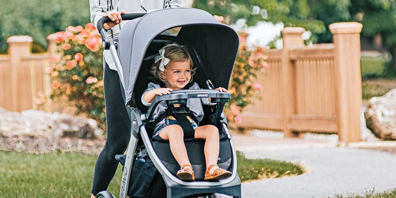 Little girl sitting in Chicco Corso LE Modular Travel System Review