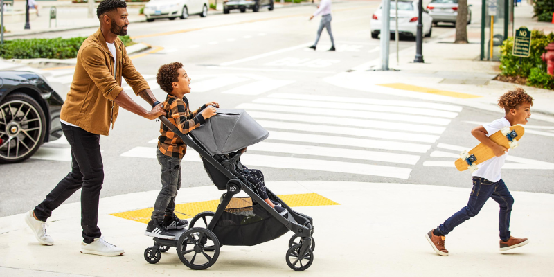Dad pushing child in Baby Jogger City Select 2 Stroller