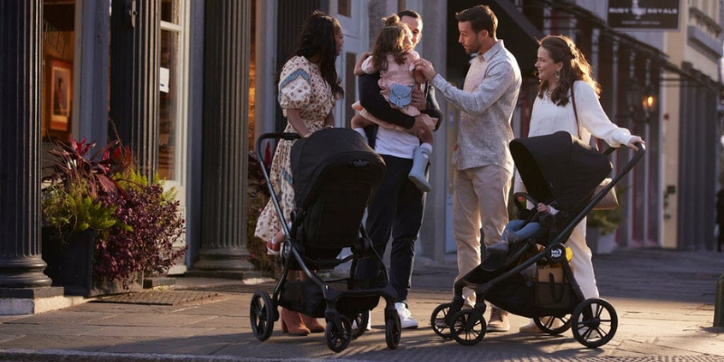 Four Adults on SideWalk With Two baby Jogger City Sights Strollers 