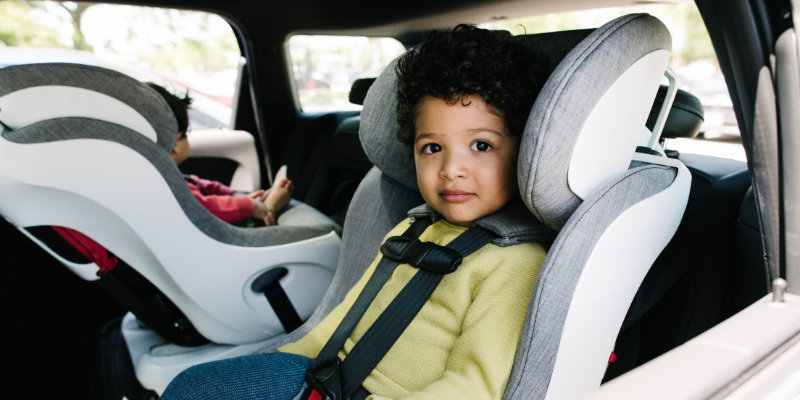 Little one sitting in a Clek Foonf Convertible Seat