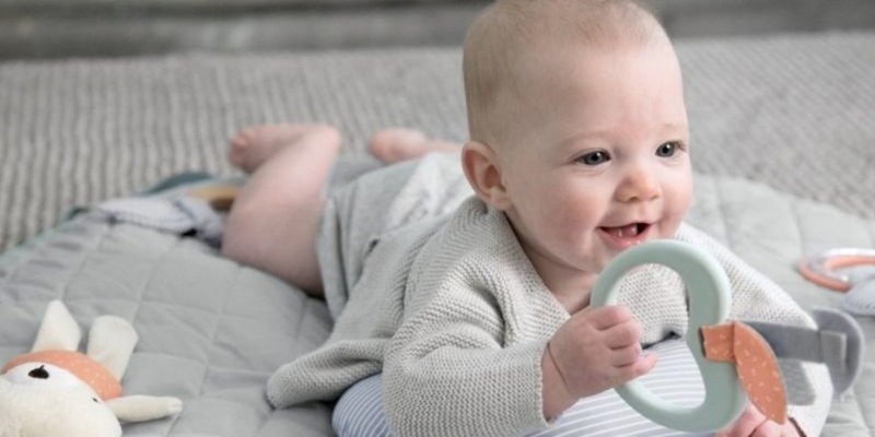 Baby playing on mat