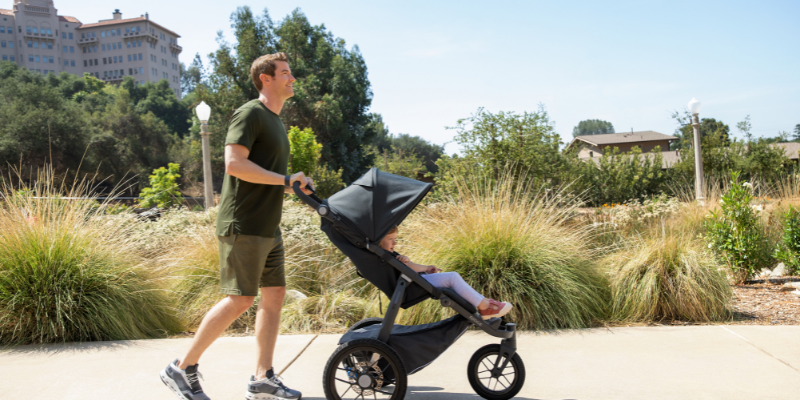 Father jogging with his child in an UPPAbaby RIDGE stroller