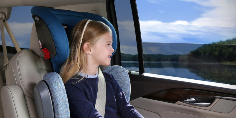 Little Girl Looking Out Window While Sitting In Britax Highpoint 2-Stage Belt-Positioning Booster Seat