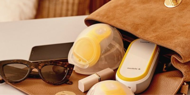 Medela Freestyle Hands-Free Pump in Purse on Table