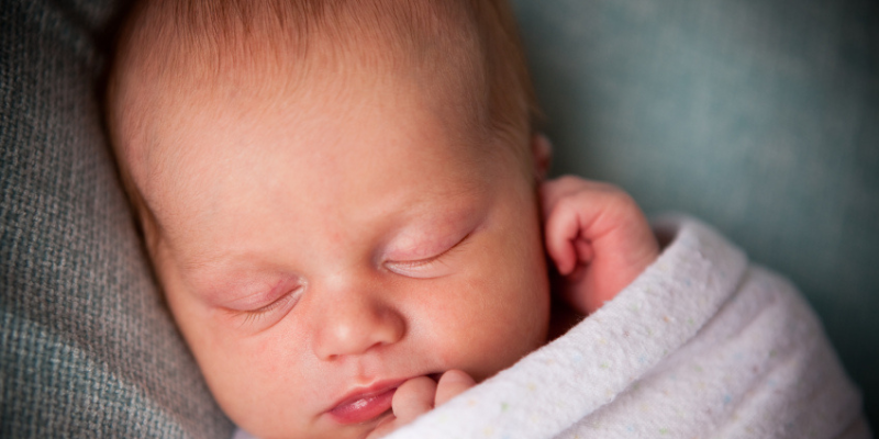 baby sleeping swaddled up
