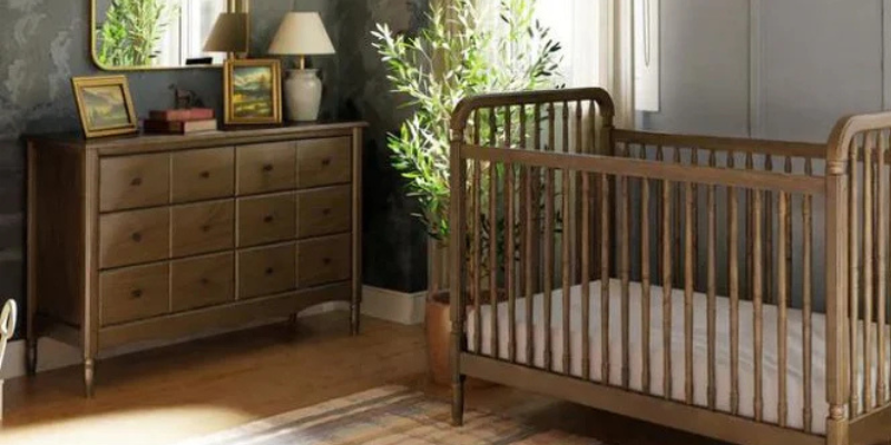 Nursery with wood crib and dresser