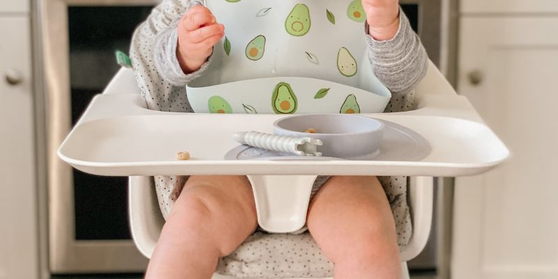 Baby sitting in a Stokke Clikk High Chair