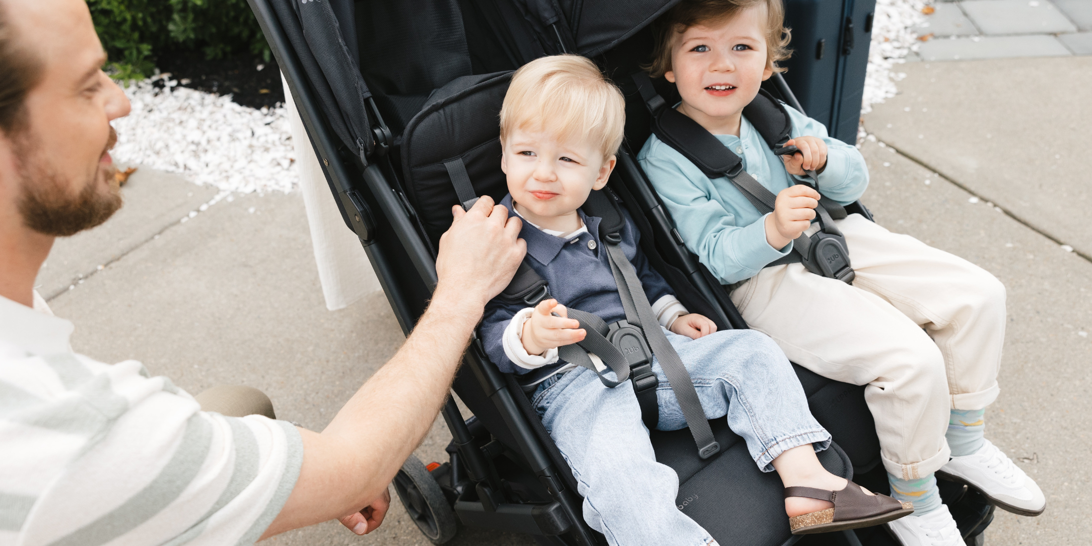 Two toddlers sitting in UPPAbaby Minu Duo Double Stroller