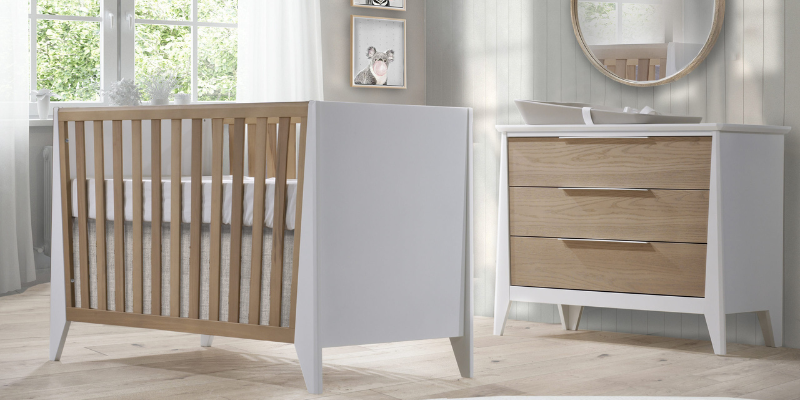 Nest Juvenile Flexx Premium Crib and dresser in nursery