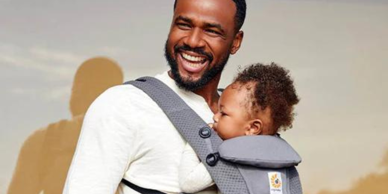 Dad carrying baby in an Ergo Baby Omni 360 Carrier