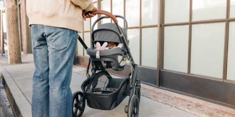 Dad pushing baby in UPPAbaby Vista V3 Travel System