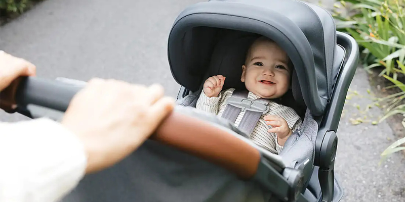 Baby in car seat attached to UPPAbaby Minu V3 Stroller