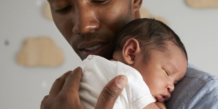 Dad holding baby