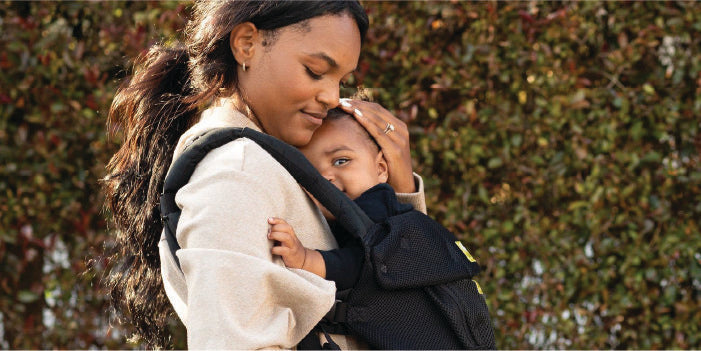 Woman Holding baby in Carrier