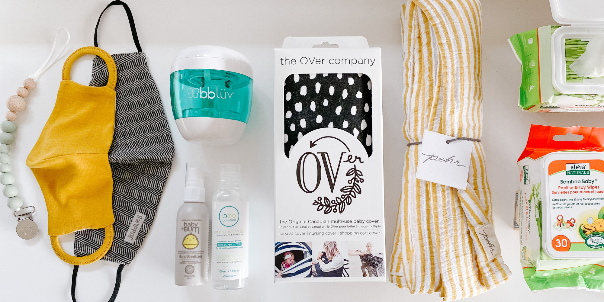 A flat lay of baby products to help keep germs away 