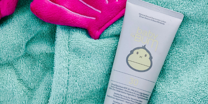 Sunscreen laid out on towel
